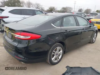 2018 Ford Fusion Hybrid S with VIN 3FA6P0UU9JR100852, listed as a IAAI auction lot 41516157 with 63,458 mi miles. Bid and sale history available at carsss.com. Image 4.
