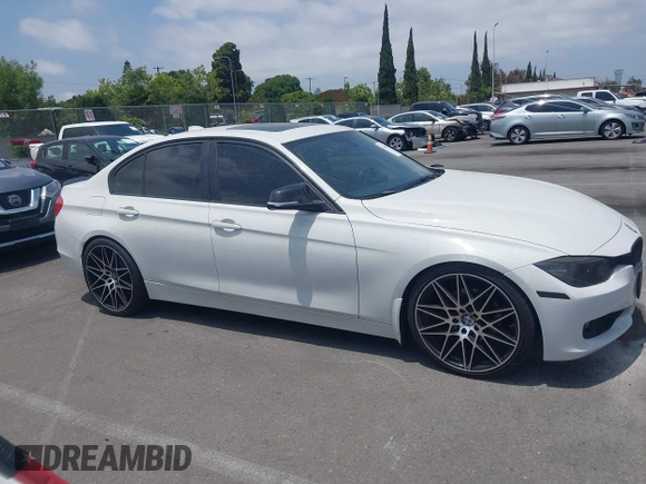 2014 BMW 3 Series 328i with VIN WBA3C1C52EK110753, listed as a IAAI auction lot 42444129 with 169,035 mi miles and . Bid and sale history available at DreamBid. Image 13.