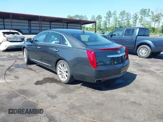 2014 Cadillac XTS Luxury z VIN 2G61M5S37E9211547, wystawiony jako IAAI lot #42373128 z przebiegiem 146 354 mil mil oraz . Historia ofert i sprzedaży dostępna na DreamBid. Obrazek 3.