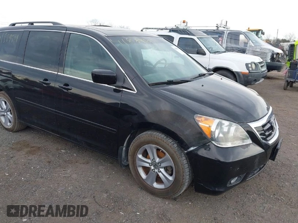 2010 Honda Odyssey Touring with VIN 5FNRL3H95AB040354, listed as a IAAI auction lot 41889501 with 155,069 mi miles. Bid and sale history available at carsss.com. Image 1.