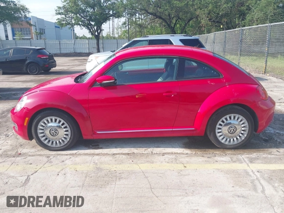 2013 Volkswagen Beetle 2.5L w/Sun/Sound/Nav with VIN 3VWJX7AT4DM672158, listed as a IAAI auction lot 42187543 with 94,961 mi miles and . Bid and sale history available at DreamBid. Image 14.