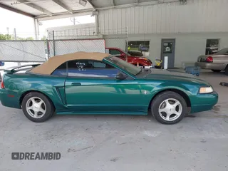2001 Ford Mustang Deluxe z VIN 1FAFP44441F198354, wystawiony jako IAAI lot #42433701 z przebiegiem 69 328 mil mil oraz . Historia ofert i sprzedaży dostępna na DreamBid. Obrazek 13.