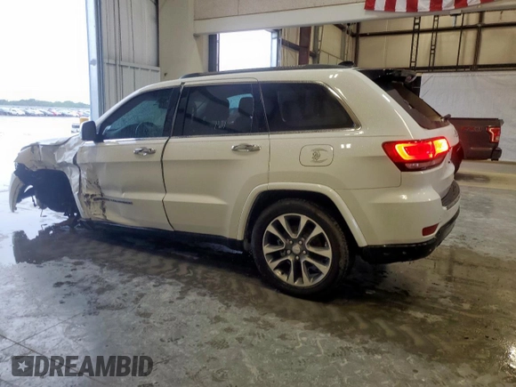 2017 Jeep Grand Cherokee Overland with VIN 1C4RJECG9HC916342, listed as a Copart auction lot 60658285 with 59,470 mi miles and Salvage title. Bid and sale history available at DreamBid. Image 2.