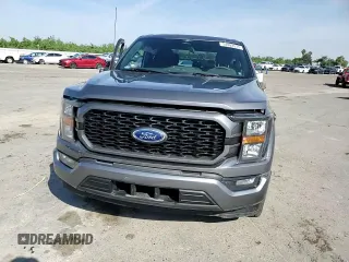 2023 Ford F-150 XL with VIN 1FTEW1CP4PKD21685, listed as a Copart auction lot 54992615 with 27,252 mi miles and Salvage title. Bid and sale history available at DreamBid. Image 13.