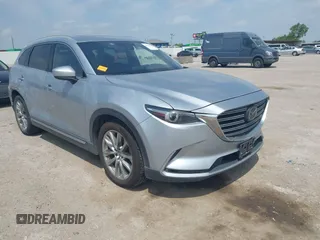 2016 Mazda CX-9 Signature with VIN JM3TCBEY9G0117785, listed as a IAAI auction lot 42331883 with 115,096 mi miles and . Bid and sale history available at DreamBid. Image 1.