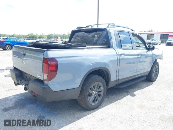 2023 Honda Ridgeline Sport z VIN 5FPYK3F13PB067936, wystawiony jako IAAI lot #41535175 z przebiegiem 27 503 mil mil oraz . Historia ofert i sprzedaży dostępna na DreamBid. Obrazek 4.