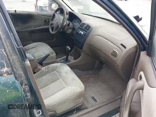 1999 Mazda Protege DX z VIN JM1BJ2222X0151674, wystawiony jako IAAI lot #42444584 z przebiegiem 219 862 mil mil oraz . Historia ofert i sprzedaży dostępna na DreamBid. Obrazek 5.