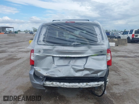 2016 Chrysler Town & Country Touring with VIN 2C4RC1BG0GR213058, listed as a IAAI auction lot 41910462 with 125,013 mi miles and . Bid and sale history available at DreamBid. Image 16.