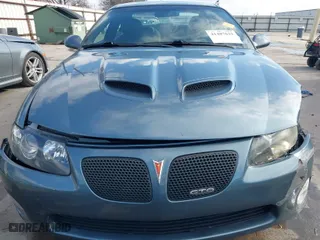2006 Pontiac GTO with VIN 6G2VX12UX6L561098, listed as a IAAI auction lot 41487635 with 69,741 mi miles. Bid and sale history available at carsss.com. Image 12.