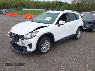 2016 Mazda CX-5 Touring with VIN JM3KE4CY0G0903723, listed as a IAAI auction lot 41966516 with 107,569 mi miles. Bid and sale history available at carsss.com. Image 2.