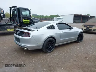 2013 Ford Mustang GT with VIN 1ZVBP8CF7D5281965, listed as a IAAI auction lot 40408688 with 121,477 mi miles. Bid and sale history available at carsss.com. Image 4.