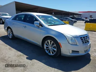 2014 Cadillac XTS Luxury z VIN 2G61N5S38E9302324, wystawiony jako IAAI lot #42345118 z przebiegiem 68 933 mil mil oraz . Historia ofert i sprzedaży dostępna na DreamBid. Obrazek 1.