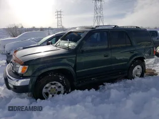 2000 Toyota 4Runner SR5 with VIN JT3GN86R1Y0148999, listed as a Copart auction lot 45800185 with 210,020 mi miles and Salvage Title. Bid and sale history available at DreamBid. Image 1.