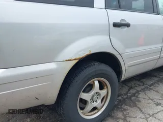 2004 Honda Pilot EX z VIN 2HKYF18524H542877, wystawiony jako IAAI lot #42340950 z przebiegiem 254 786 mil mil oraz . Historia ofert i sprzedaży dostępna na DreamBid. Obrazek 13.