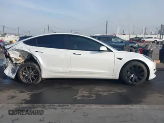 2021 Tesla Model 3 Long Range with VIN 5YJ3E1EB0MF009965, listed as a IAAI auction lot 41478233 with 31,713 mi miles and . Bid and sale history available at DreamBid. Image 13.