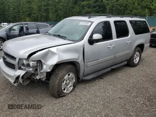 2012 Chevrolet Suburban LT with VIN 1GNSKJE77CR128130, listed as a Copart auction lot 62124555 with 174,405 mi miles and Salvage title. Bid and sale history available at DreamBid. Image 1.