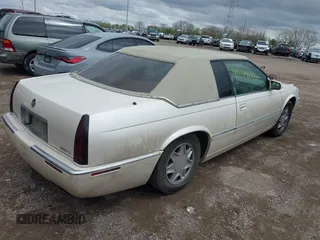 2002 Cadillac Eldorado ESC with VIN 1G6EL12Y92B100940, listed as a IAAI auction lot 42094683 with 146,859 mi miles. Bid and sale history available at carsss.com. Image 4.