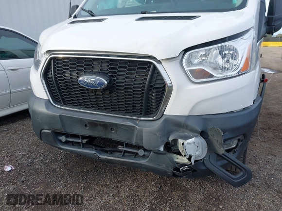 2021 Ford Transit Cargo with VIN 1FTBR1Y81MKA25014, listed as a IAAI auction lot 41594717 with 49,983 mi miles and . Bid and sale history available at DreamBid. Image 6.