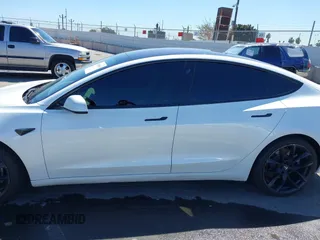 2019 Tesla Model 3 Mid Range with VIN 5YJ3E1EA5KF327181, listed as a IAAI auction lot 41860943 with 157,335 mi miles and . Bid and sale history available at DreamBid. Image 14.