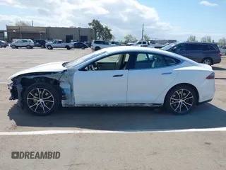2014 Tesla Model S 60 with VIN 5YJSA1H10EFP56526, listed as a IAAI auction lot 41871784 with 143,361 mi miles and . Bid and sale history available at DreamBid. Image 15.