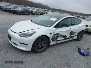 2021 Tesla Model 3 Long Range with VIN 5YJ3E1EBXMF980102, listed as a IAAI auction lot 41944364 with 48,766 mi miles and . Bid and sale history available at carsss.com. Image 17.