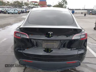 2022 Tesla Model Y Long Range z VIN 7SAYGDEE0NF508958, wystawiony jako IAAI lot #42191819 z przebiegiem 60 880 mil mil oraz . Historia ofert i sprzedaży dostępna na DreamBid. Obrazek 16.