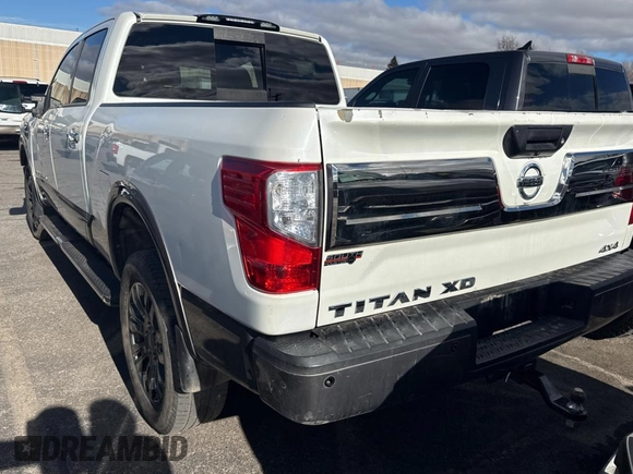 2016 Nissan Titan XD PRO-4X with VIN 1N6BA1F40GN515810, listed as a Copart auction lot 87436204 with 210,650 mi miles and Clean Title. Bid and sale history available at carsss.com. Image 3.