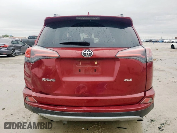 2018 Toyota RAV4 XLE with VIN 2T3WFREV7JW429781, listed as a Copart auction lot 51759485 with 72,792 mi miles and Salvage Title. Bid and sale history available at DreamBid. Image 6.