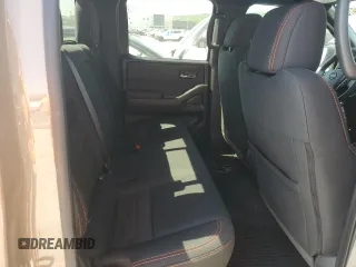 2023 Nissan Frontier Pro-4X with VIN 1N6ED1EK0PN668109, listed as a Copart auction lot 57064975 with 6,406 mi miles and Salvage title. Bid and sale history available at DreamBid. Image 10.