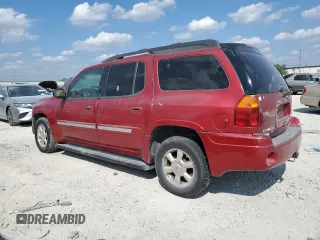 2002 GMC Envoy SLT with VIN 1GKES16S526121741, listed as a Copart auction lot 71957034 with 276,328 mi miles and Salvage Title. Bid and sale history available at DreamBid. Image 2.