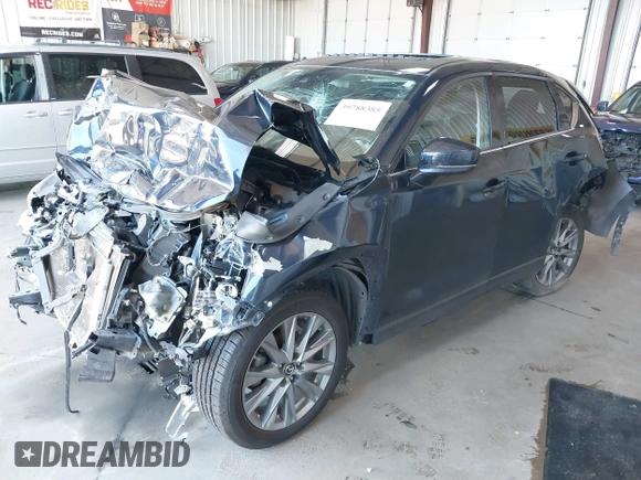 2020 Mazda CX-5 Grand Touring with VIN JM3KFBDM8L0781491, listed as a IAAI auction lot 39788385 with 57,316 mi miles and . Bid and sale history available at carsss.com. Image 20.