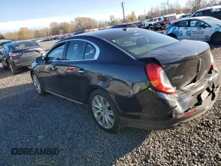 2014 Lincoln MKS EcoBoost with VIN 1LNHL9FT2EG600500, listed as a Copart auction lot 83764694 with 74,949 mi miles and Salvage title. Bid and sale history available at DreamBid. Image 2.