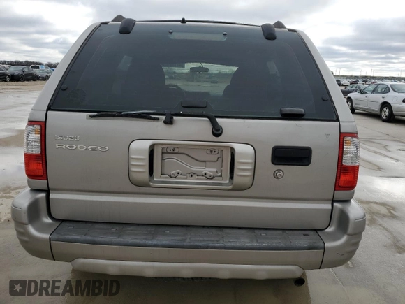 2004 Isuzu Rodeo S with VIN 4S2CK58W344311048, listed as a Copart auction lot 45154765 with 128,733 mi miles and Clean Title. Bid and sale history available at DreamBid. Image 6.