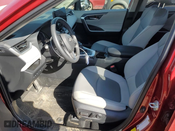 2024 Toyota RAV4 Hybrid XLE Premium with VIN JTMB6RFVXRD120389, listed as a Copart auction lot 47596985 with 16,956 mi miles and Salvage Title. Bid and sale history available at DreamBid. Image 7.