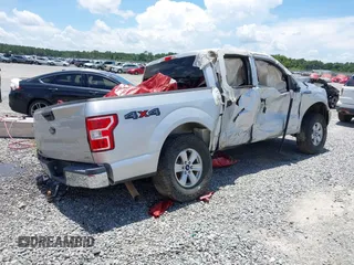 2018 Ford F-150 XL with VIN 1FTEW1EG6JFD14007, listed as a IAAI auction lot 36180966 with 124,521 mi miles and . Bid and sale history available at DreamBid. Image 4.