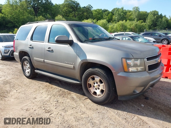 2007 Chevrolet Tahoe LS z VIN 1GNFC13027R231885, wystawiony jako IAAI lot #42750247 z przebiegiem 167 072 mil mil oraz . Historia ofert i sprzedaży dostępna na DreamBid. Obrazek 1.