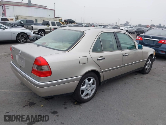1995 Mercedes-Benz C with VIN WDBHA28E2SF191740, listed as a IAAI auction lot 41172625 with 331,540 mi miles. Bid and sale history available at carsss.com. Image 4.