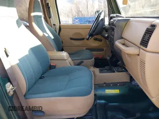 2000 Jeep Wrangler Sahara with VIN 1J4FA59S0YP724521, listed as a IAAI auction lot 41574689 with 167,584 mi miles. Bid and sale history available at carsss.com. Image 5.
