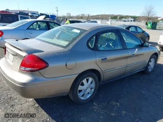 2005 Ford Taurus SEL with VIN 1FAFP56S05A158275, listed as a IAAI auction lot 41869232 with 136,477 mi miles. Bid and sale history available at carsss.com. Image 4.