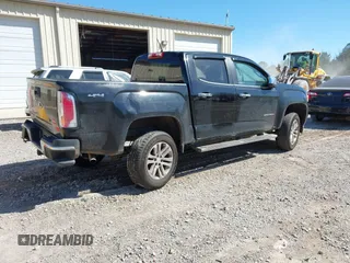 2015 GMC Canyon 2WD SLT with VIN 1GTG5CE35F1249224, listed as a IAAI auction lot 41697796 with 180,230 mi miles. Bid and sale history available at carsss.com. Image 4.