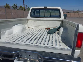 1990 Ford F-150 with VIN 2FTDF15N6LCA44303, listed as a IAAI auction lot 41981297 with 63,097 mi miles. Bid and sale history available at carsss.com. Image 8.