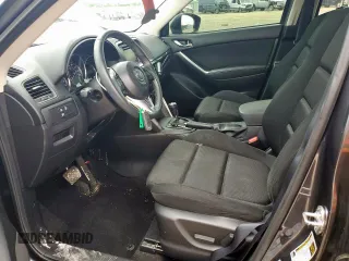 2014 Mazda CX-5 Touring z VIN JM3KE2CY7E0308580, wystawiony jako Copart lot #60565835 z przebiegiem 92 708 mil mil oraz Szkoda całkowita • Salvage title. Historia ofert i sprzedaży dostępna na DreamBid. Obrazek 7.
