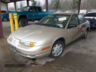 2002 Saturn SL z VIN 1G8ZH52852Z155698, wystawiony jako IAAI lot #41712058 z przebiegiem 90 150 mil mil oraz . Historia ofert i sprzedaży dostępna na DreamBid. Obrazek 2.