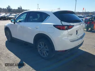 2021 Mazda CX-5 Grand Touring with VIN JM3KFBDM6M0483135, listed as a IAAI auction lot 41590430 with 33,466 mi miles. Bid and sale history available at carsss.com. Image 3.