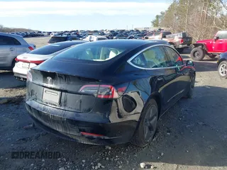 2019 Tesla Model 3 Mid Range z VIN 5YJ3E1EA4KF317872, wystawiony jako IAAI lot #41491269 z przebiegiem 90 772 mil mil oraz . Historia ofert i sprzedaży dostępna na DreamBid. Obrazek 4.