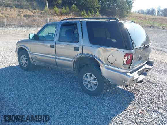2001 GMC Jimmy SLE z VIN 1GKDT13W812117348, wystawiony jako IAAI lot #41846712 z przebiegiem 180 977 mil mil oraz . Historia ofert i sprzedaży dostępna na DreamBid. Obrazek 3.