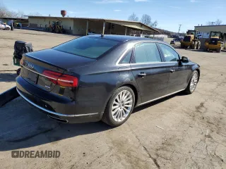 2015 Audi A8 3.0T z VIN WAU3GAFD3FN021393, wystawiony jako Copart lot #46236194 z przebiegiem 58 015 mil mil oraz Szkoda całkowita • Salvage title. Historia ofert i sprzedaży dostępna na DreamBid. Obrazek 3.