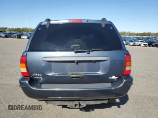 2004 Jeep Grand Cherokee Laredo z VIN 1J4GW48S74C159381, wystawiony jako Copart lot #53972115 z przebiegiem 128 309 mil mil oraz Szkoda całkowita • Salvage title. Historia ofert i sprzedaży dostępna na DreamBid. Obrazek 6.