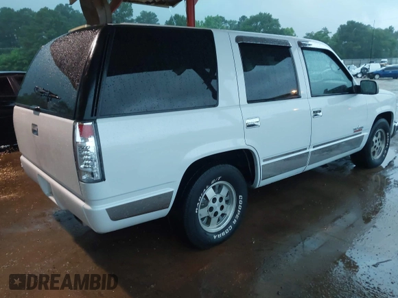 1995 Chevrolet Tahoe with VIN 1GNEC13K3SJ392069, listed as a IAAI auction lot 42192301 with 182,262 mi miles and . Bid and sale history available at DreamBid. Image 4.