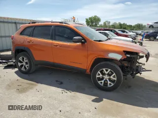 2015 Jeep Cherokee Trailhawk with VIN 1C4PJMBS5FW523019, listed as a Copart auction lot 55527955 with 107,503 mi miles and Salvage title. Bid and sale history available at DreamBid. Image 4.